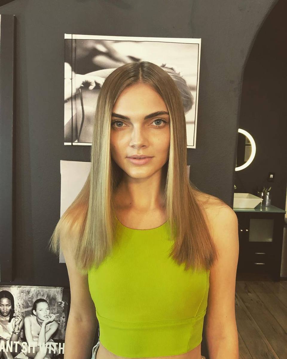 Long, straight dirty-blonde hair with face-framing highlights